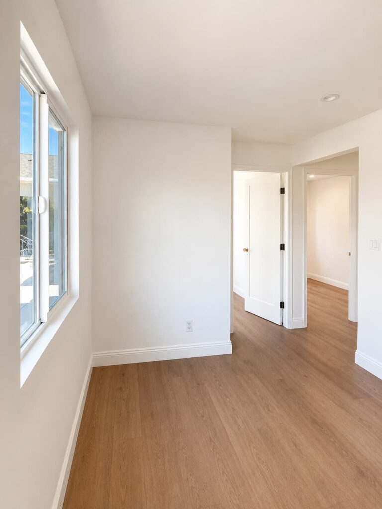 Finished living area with wood flooring inside a South Gate ADU